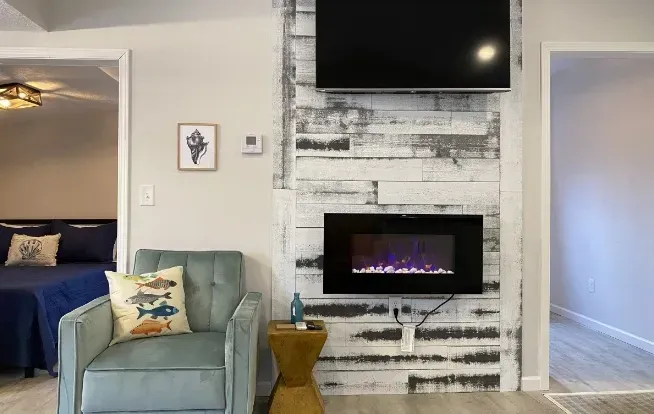 A warm fireplace glow for quiet nights and easy conversation.