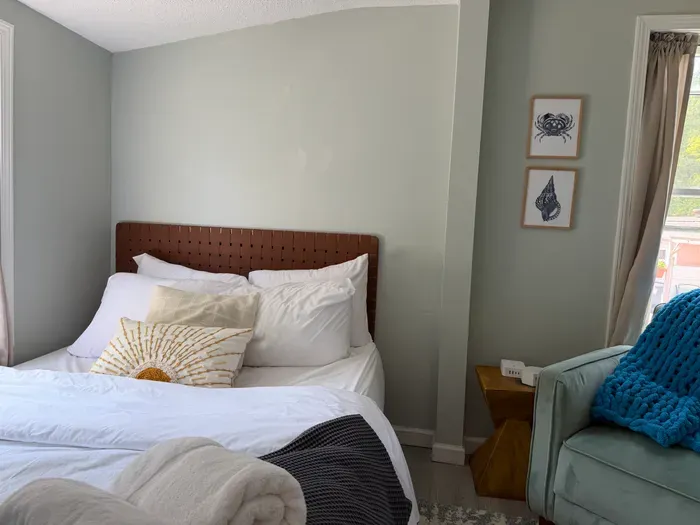 Comfortable bedroom with soft linens for a restful night's sleep.