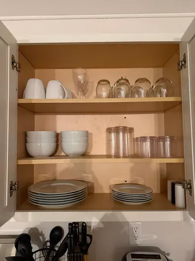 Well-stocked kitchen essentials—glassware, dishes, and everything you need.