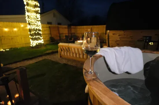 Wine glass beside the sauna at Pause Point Cottage, a 17-minute drive from SPIRE Institute & Academy in Geneva, Ohio