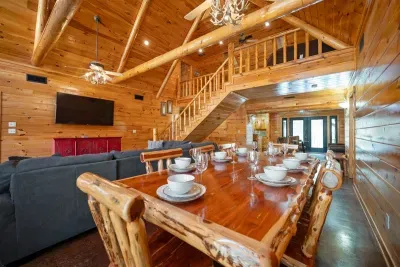 Large open concept living and dining with a view of the loft