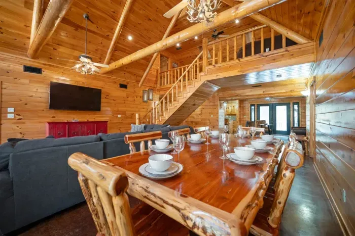 Large open concept living and dining with a view of the loft