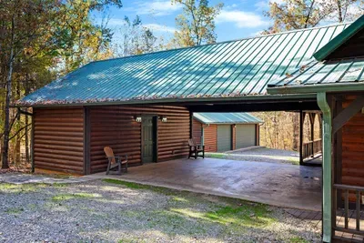 Covered carport leading out to the game room garage