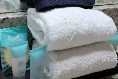 Welcome toiletries and a makeup toel in upstairs bathroom.