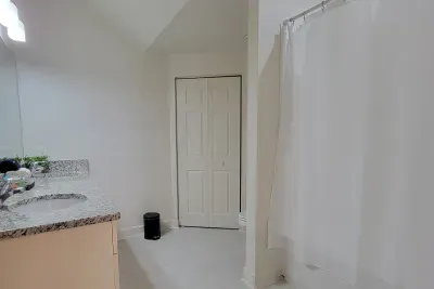 Downstairs bathroom with walk-in closet.