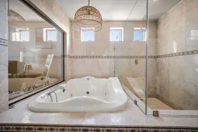 Jacuzzi and oversized walk-in shower