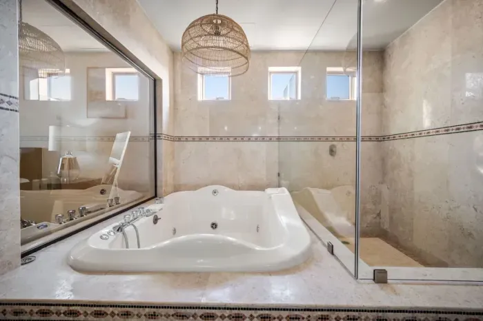 Jacuzzi and oversized walk-in shower