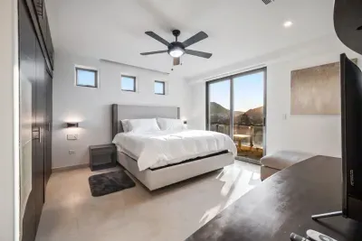3rd bedroom with balcony overlooking the city