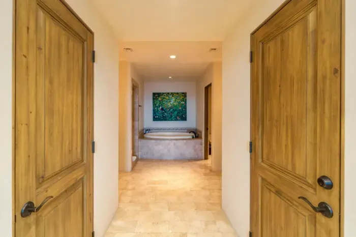 Main bath with dual sinks, shower, toilet, soaking tub