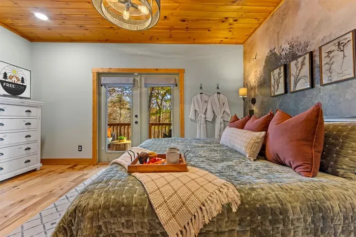 Sleep beneath the mountain mural — a cozy and unique bedroom with nature-inspired tone