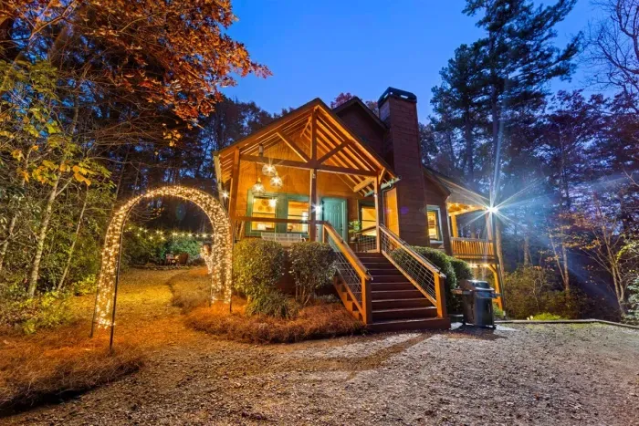 Memory Maker glowing at dusk — totally private cabin tucked in nature