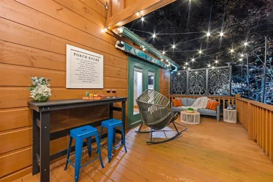 Sip, chat, and unwind under twinkle lights at your private outdoor lounge