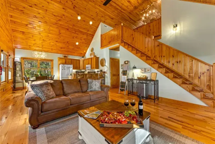 Spacious living area with plush seating — gather, relax, and connect