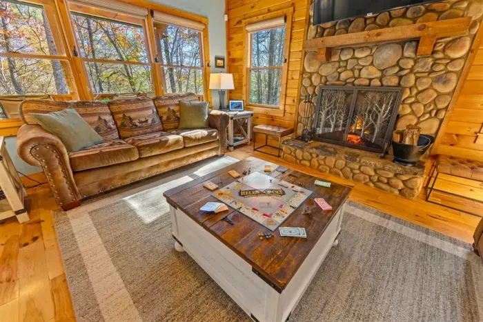 Cozy up by the crackling fire — movie nights and warm cabin ambiance await