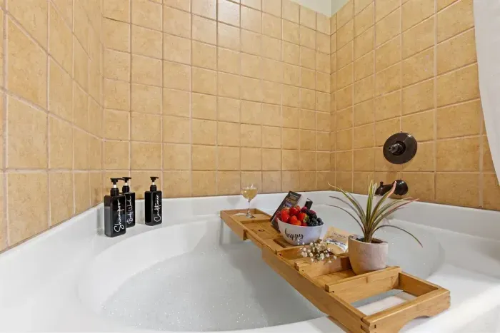 Private spa experience — soak in the deep tub with bath tray essentials