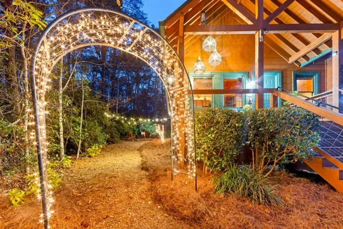 An enchanting welcome — follow the lit archway to your private retreat