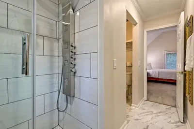 Experience luxury in the walk-in shower with multiple jets – the perfect way to relax after a day of exploring at Helen Waldhaus.