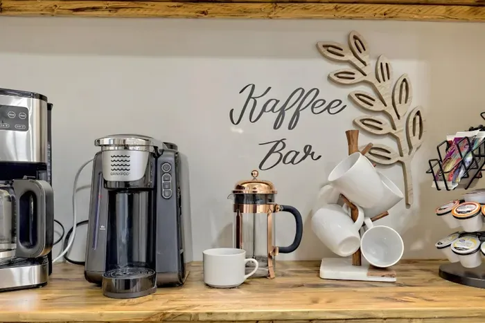 Fully stocked coffee bar for easy mornings and slow starts Multiple brewing options, mugs, and essentials ready for your stay.