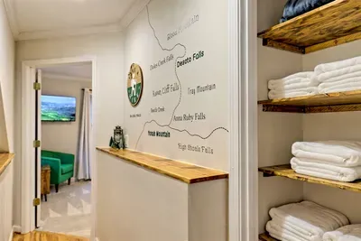 "Discover the best local hiking spots with our custom trail map, featuring popular destinations like Desoto Falls, Anna Ruby Falls, and Yonah Mountain. Conveniently located in the hallway, it's your guide to exploring nature during your stay."