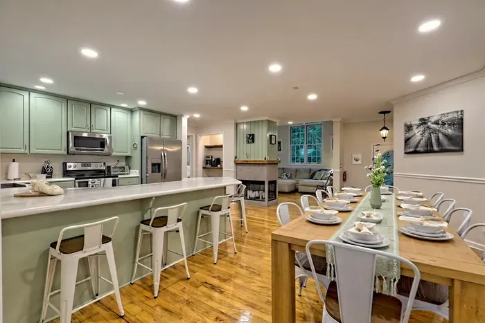 Step into the charming kitchen and dining area at Helen Waldhaus, perfect for gathering with friends and family. Whether you're enjoying a home-cooked meal or sharing stories over coffee, this