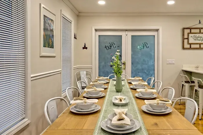 Spacious dining table for meals, games, and gathering together Comfortable seating and an open layout make this a favorite spot for shared moments.