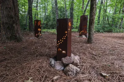 The property feels tucked into the woods, not next to neighbors.
