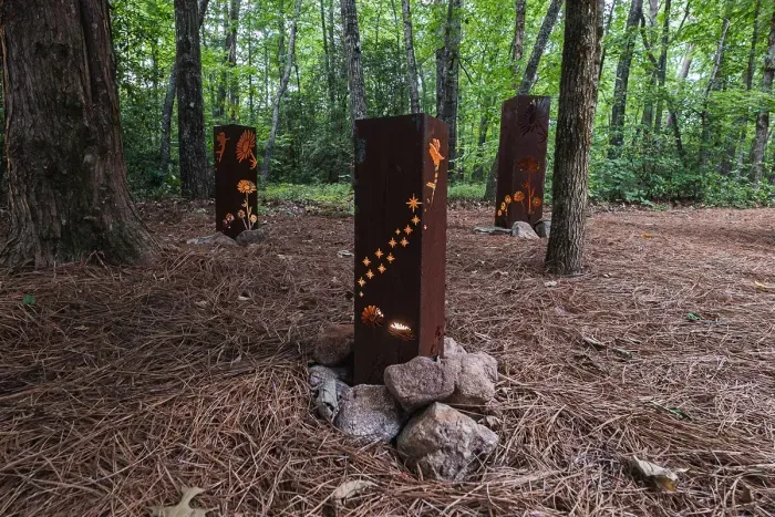 The property feels tucked into the woods, not next to neighbors.