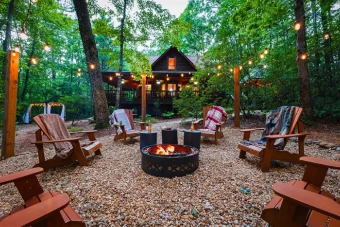 Evenings naturally gather here — firelight, conversation, and no rush to go inside.