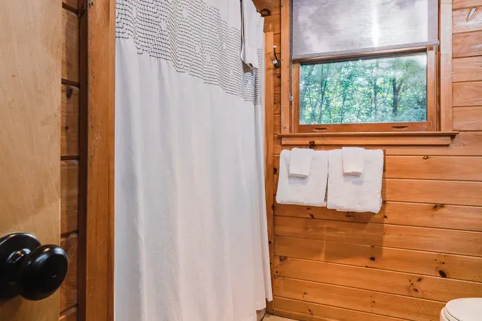 A full shower and tub — warm up after time outdoors.