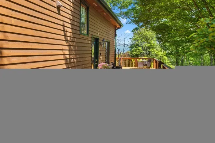 Outdoor dining space on the deck — enjoy meals with fresh mountain air.