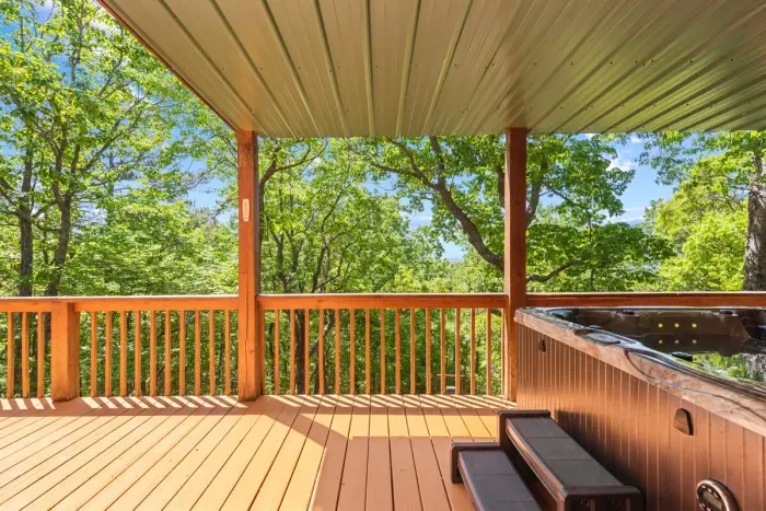 Covered porch space offering shade and comfortable seating throughout the day.