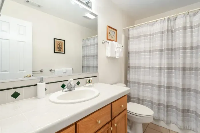 Upstairs full bathroom with clean, functional layout.