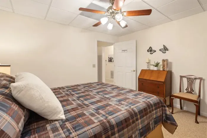 Another view of the downstairs queen room — simple, comfortable, and private.