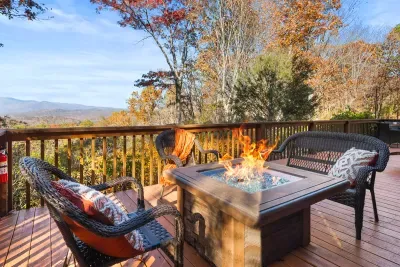 Gather around the fire table and take in the fall mountain view.