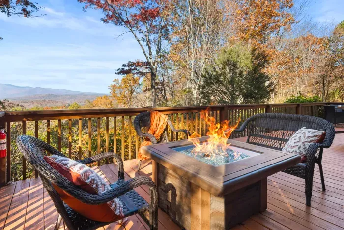 Gather around the fire table and take in the fall mountain view.