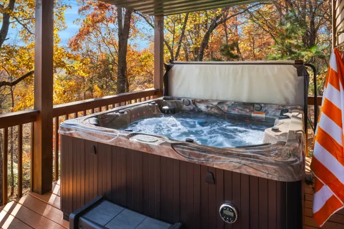 Sink into the hot tub as the trees glow with fall color around you.