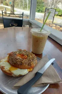 Bagel sandwich and an iced drink on the porch at Sweetwater Coffeehouse in Sautee Nacoochee.