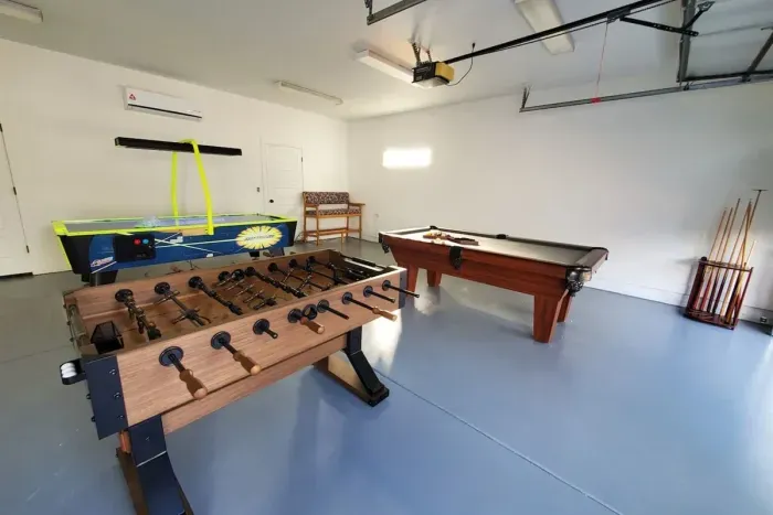 Game room with pool table, air hockey and Foosball table. 