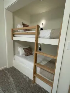 New built in bunk beds (twin beds) with custom alder ladder and memory foam mattresses