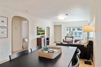 6 person dining table opens to kitchen and living spaces