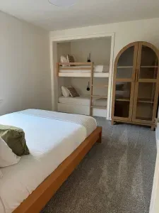 This room is spacious with built in twin bunk beds, a queen bed, and armoire closet