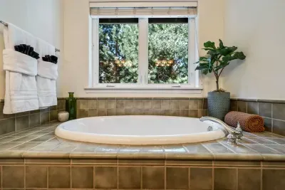 Soaking tub in primary ensuite bathroom