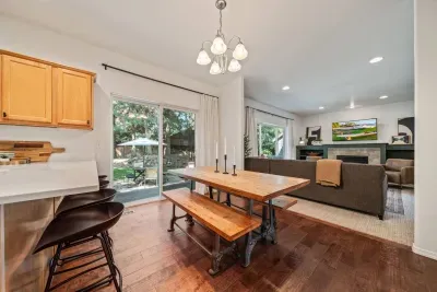 Open concept dining and kitchen, both open to living room