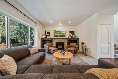 Newly updated living room with modern furnishings and Roku TV