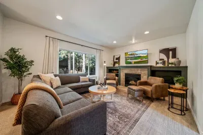 Newly updated living room with modern furnishings and Roku TV