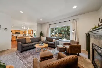 Newly updated living room with modern furnishings and Roku TV