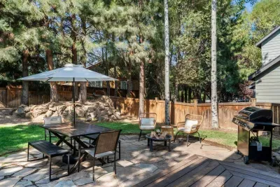 Quiet and private wooded backyard with hot tub, firepit and dining set