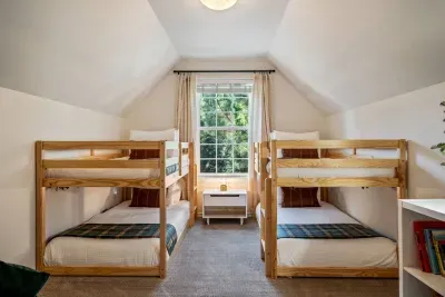 4th bedroom (only accessible through primary suite) complete with 2 double bunks, sleeps 4!