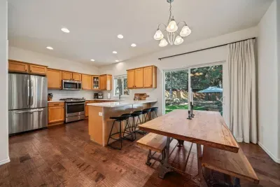 Open concept dining and kitchen, both open to living room