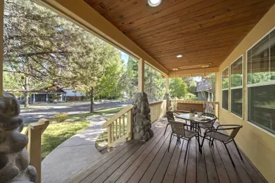 Front porch offers dining seating and porch swing to enjoy a quiet book. You'll find this street is super quiet with little traffic, but walkable to some incredible spots in town!
